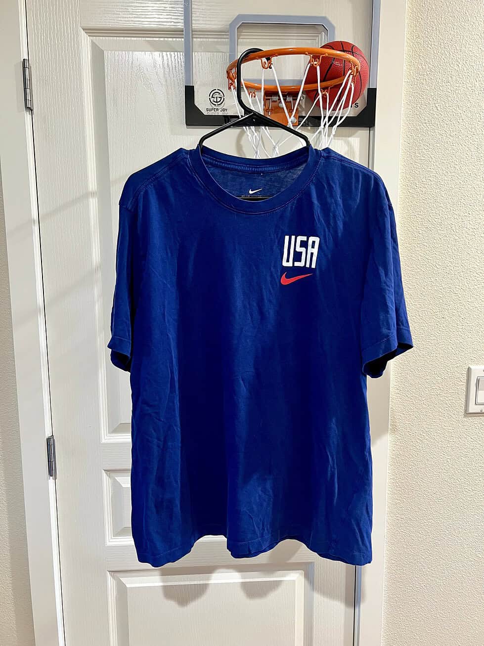 Front view of a Nike USA Soccer T-shirt with "USA" text and red Nike swoosh, Adult XL.