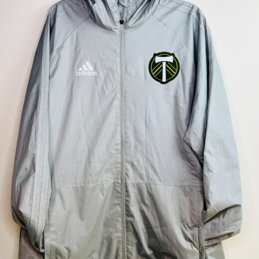 Front view of Portland Timbers Adidas hooded jacket with crest and zipper
