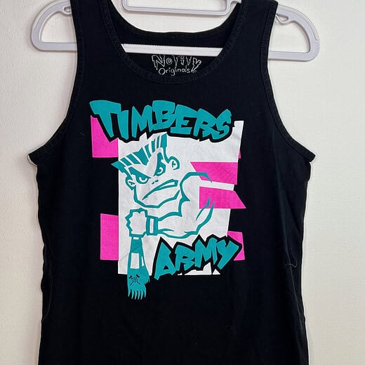 Timbers Army sleeveless tank top with punk-inspired mascot graphic in teal and pink
