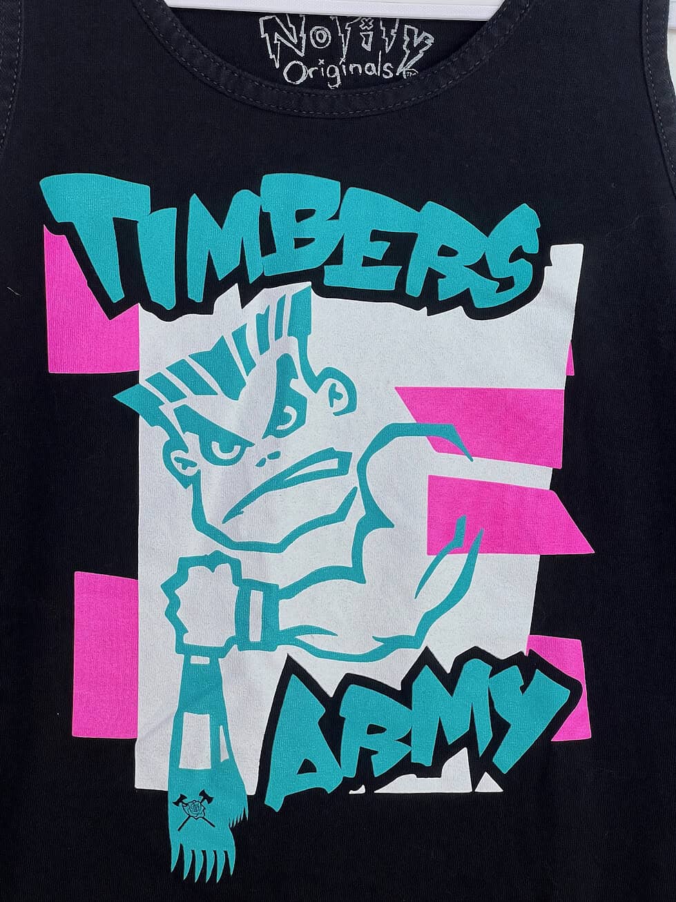 Close-up of Timbers Army graphic with mohawked mascot on front