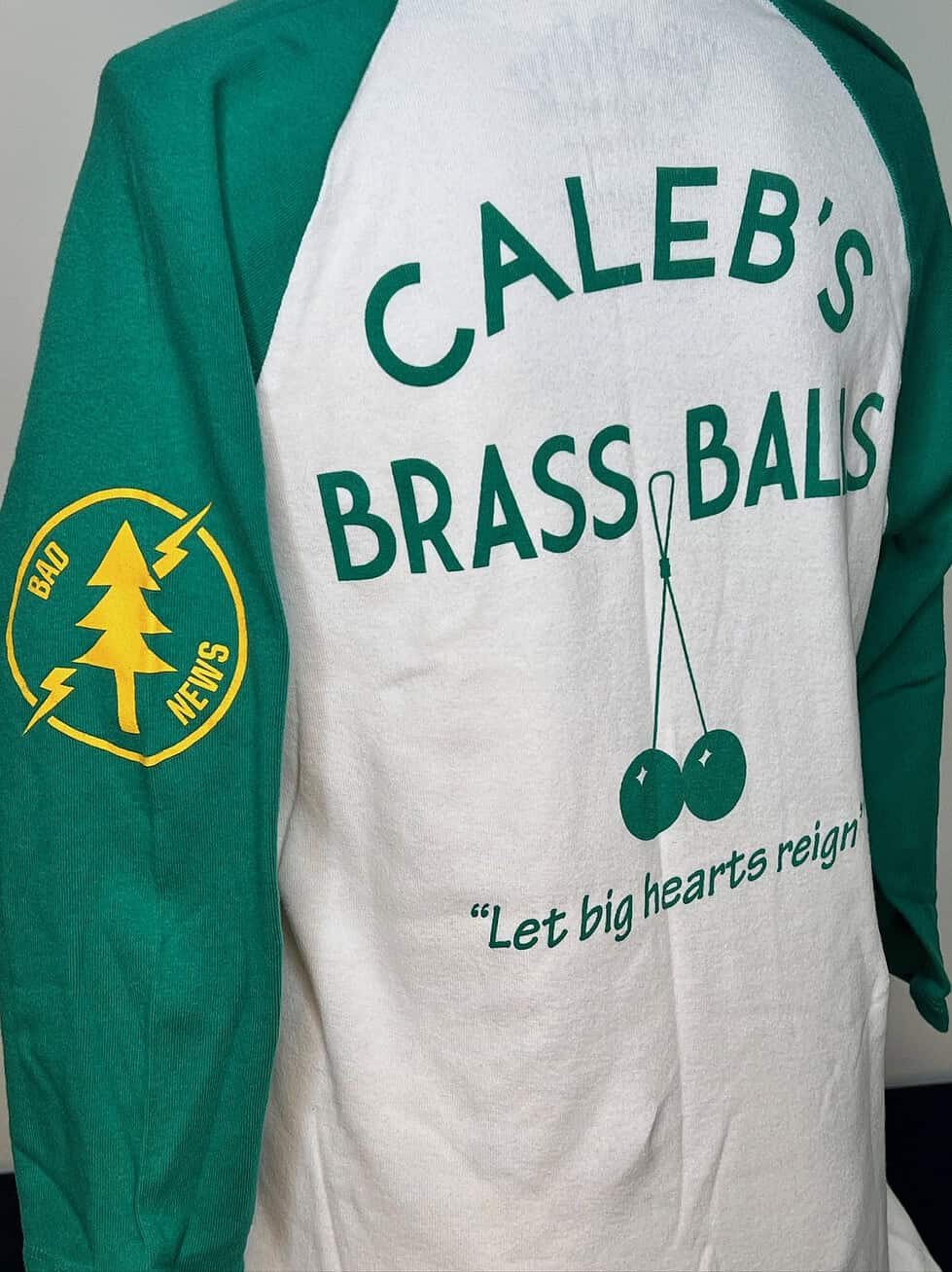 Back of shirt reading “Caleb’s Brass Balls” and “Let big hearts reign”