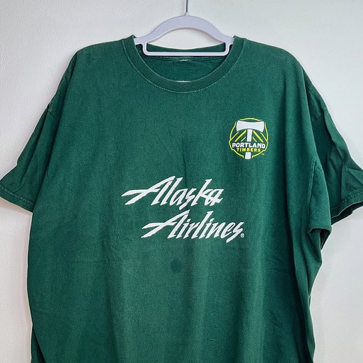 Front view of Portland Timbers green t-shirt with team crest