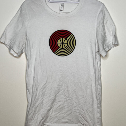 White t-shirt displaying round version of logo