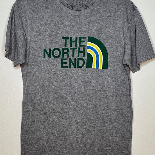 Front of t-shirt. Light heather grey with North Face-style logo in green, yellow, and blue with text replaced with words "The North End"