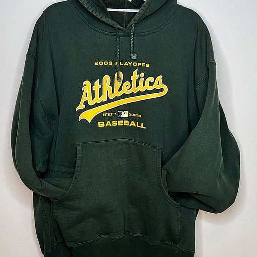 Front of hoodie. Dark green with yellow text