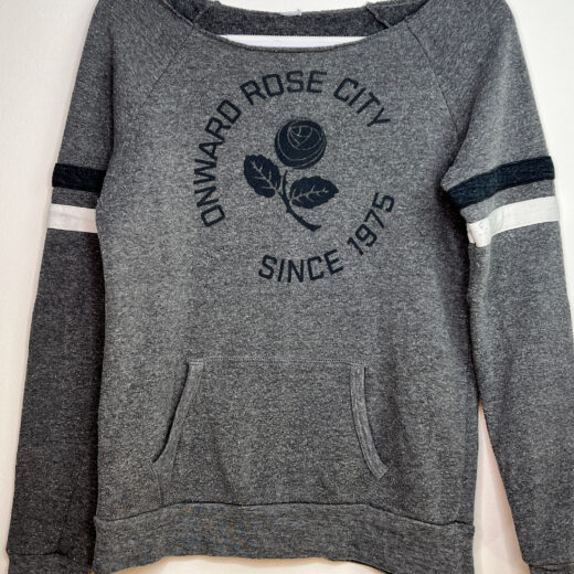 Front of Onward Rose City sweater with rose emblem and supporter slogan