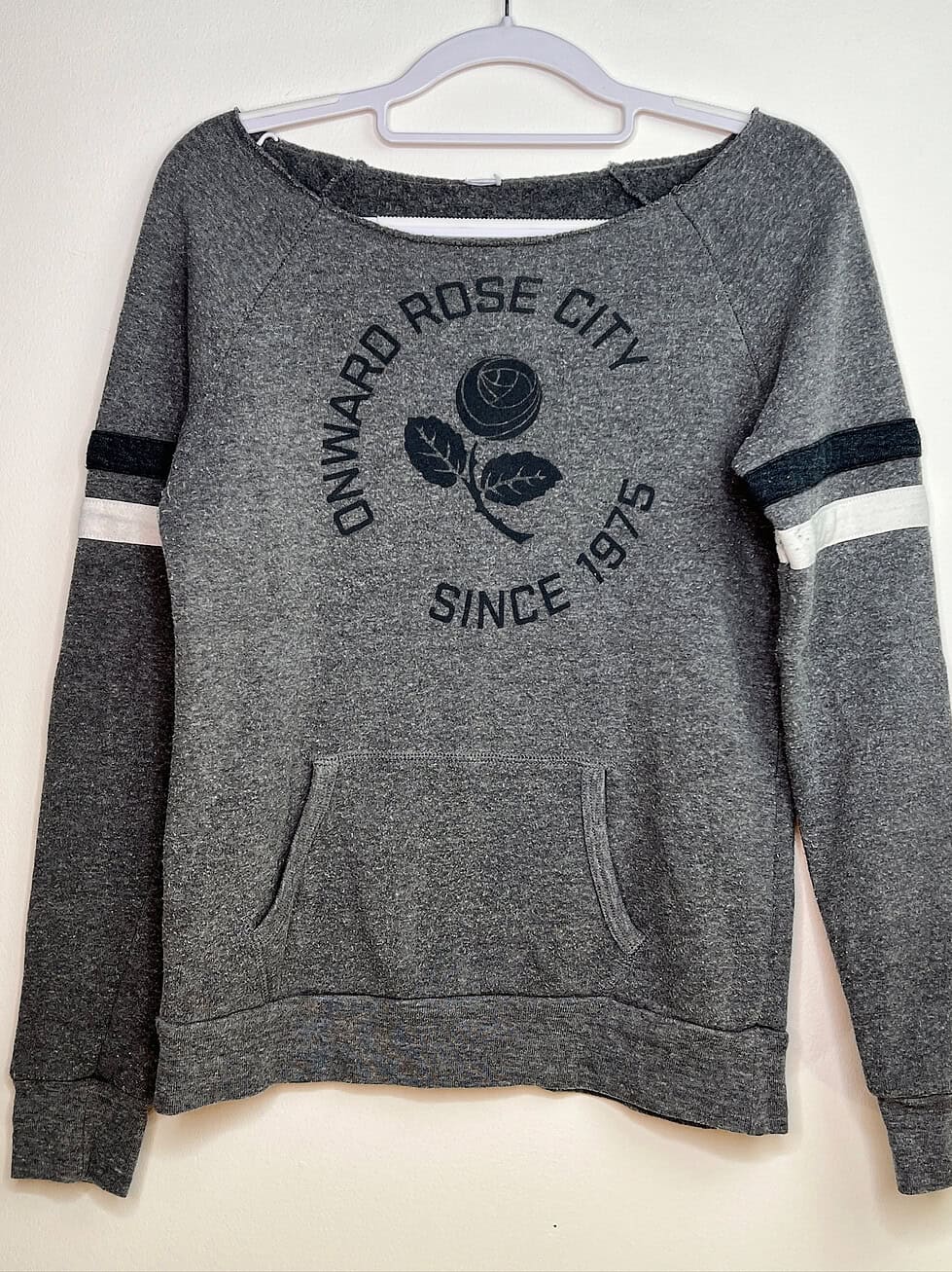 Front of Onward Rose City sweater with rose emblem and supporter slogan