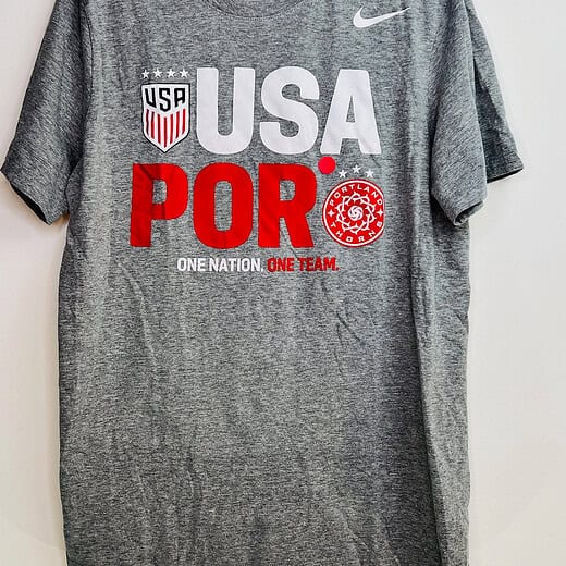 Front of gray Nike USA x Portland Thorns t-shirt with dual crests