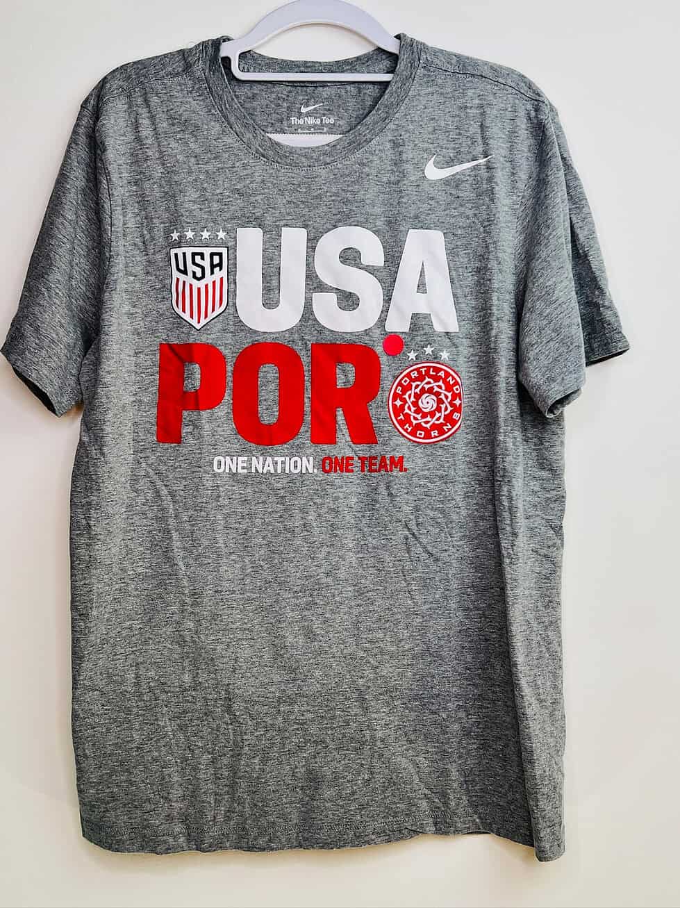 Front of gray Nike USA x Portland Thorns t-shirt with dual crests