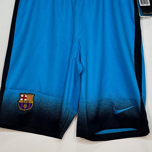 Front of blue shorts with tag attached