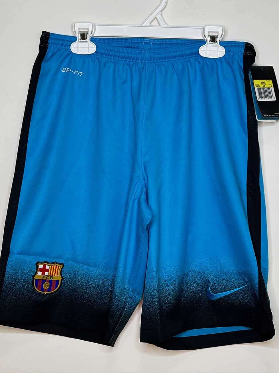 Front of blue shorts with tag attached