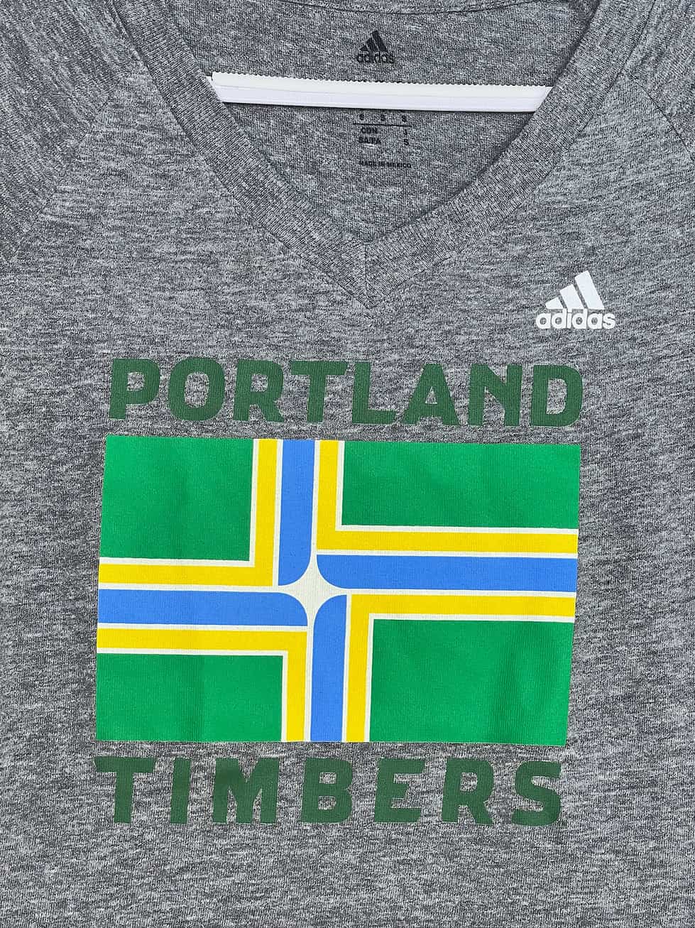 Close-up of Portland city flag and Adidas logo
