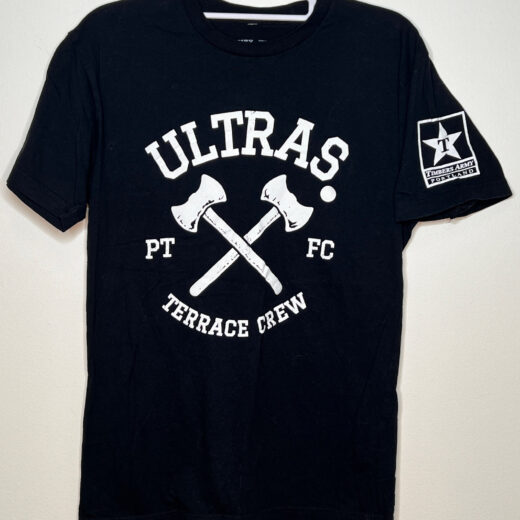 Front of t-shirt. Black with white Ultras Terrace Crew logo and two crossed axes. Star logo on sleeve