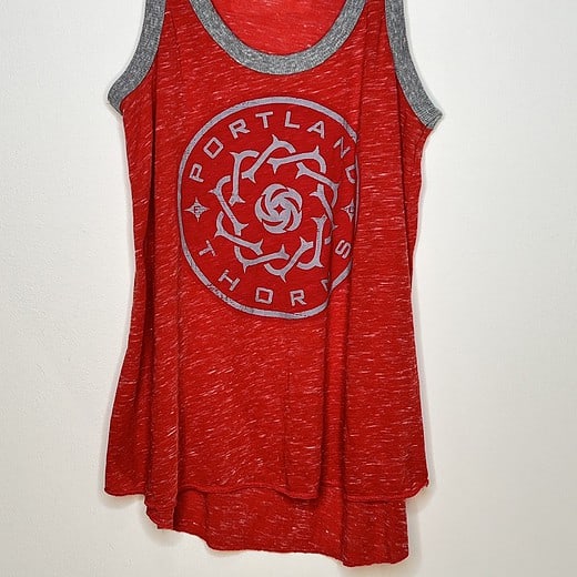 Front view of red Portland Thorns FC racerback tank with crest.
