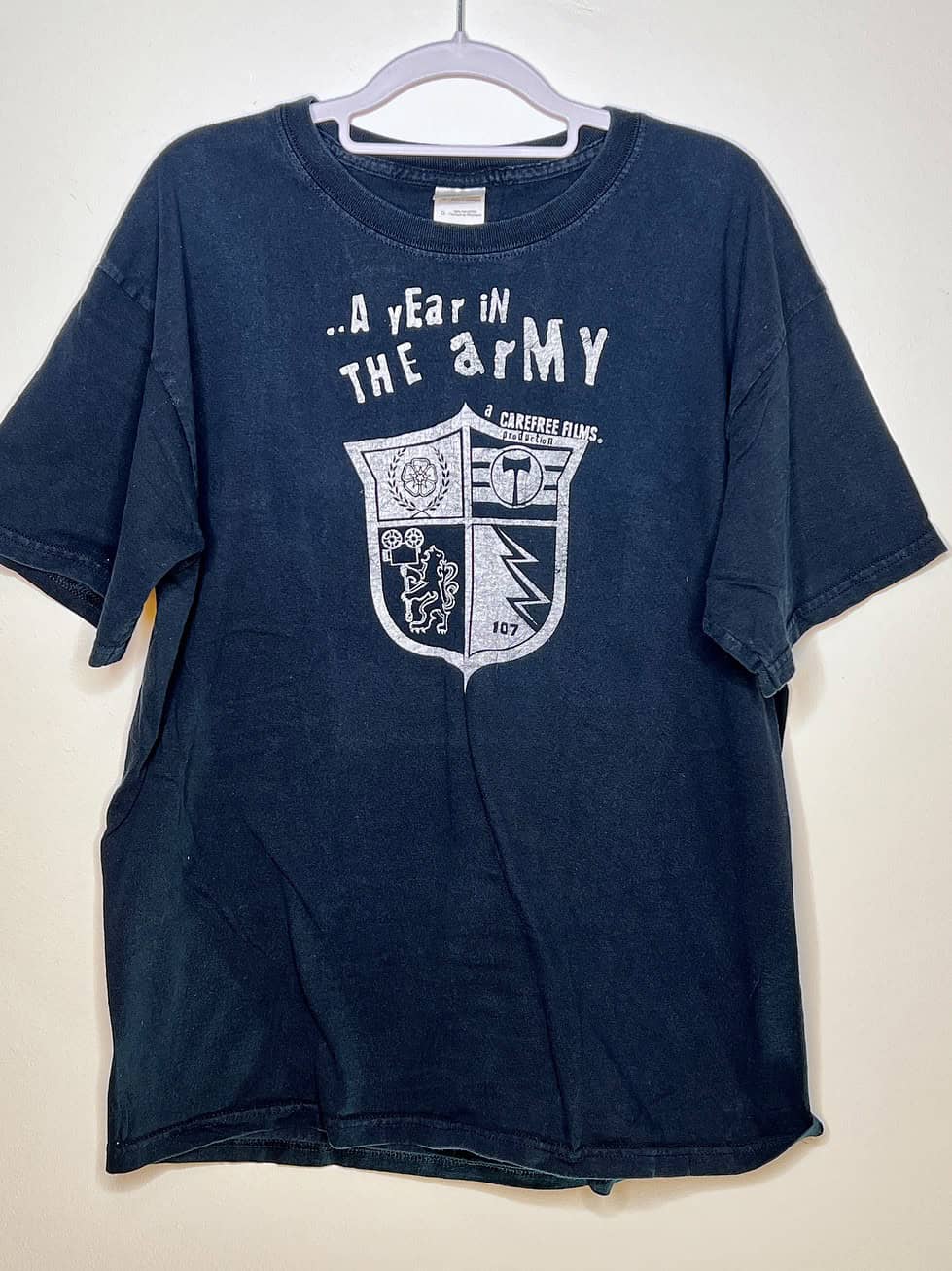 Front view of black Timbers Army “A Year in the Army” tee with crest graphic,