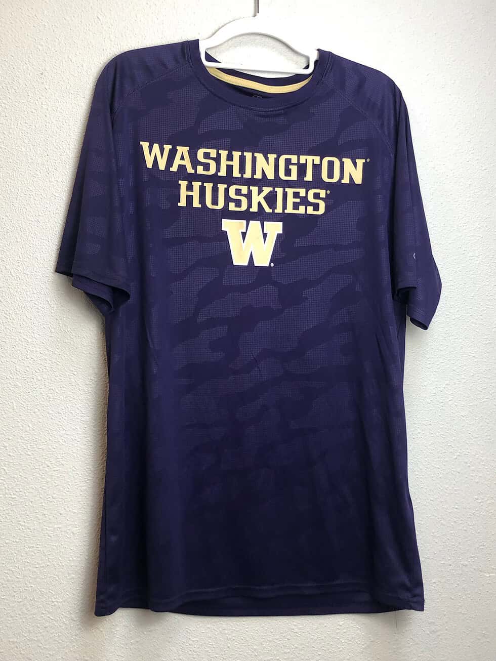 Front view of purple Washington Huskies Champion camo tee with gold “Washington Huskies” text and “W” logo.