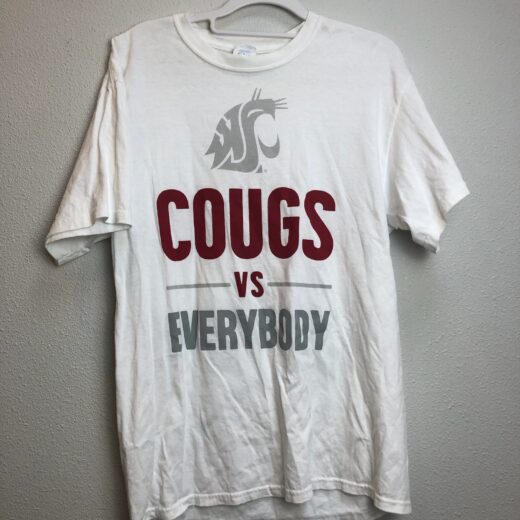 Front view of white WSU “Cougs vs Everybody” t-shirt with crimson and gray graphics.