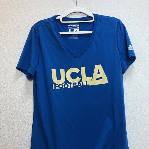 Front view of UCLA Football Adidas V-neck tee in blue with gold lettering (size large)