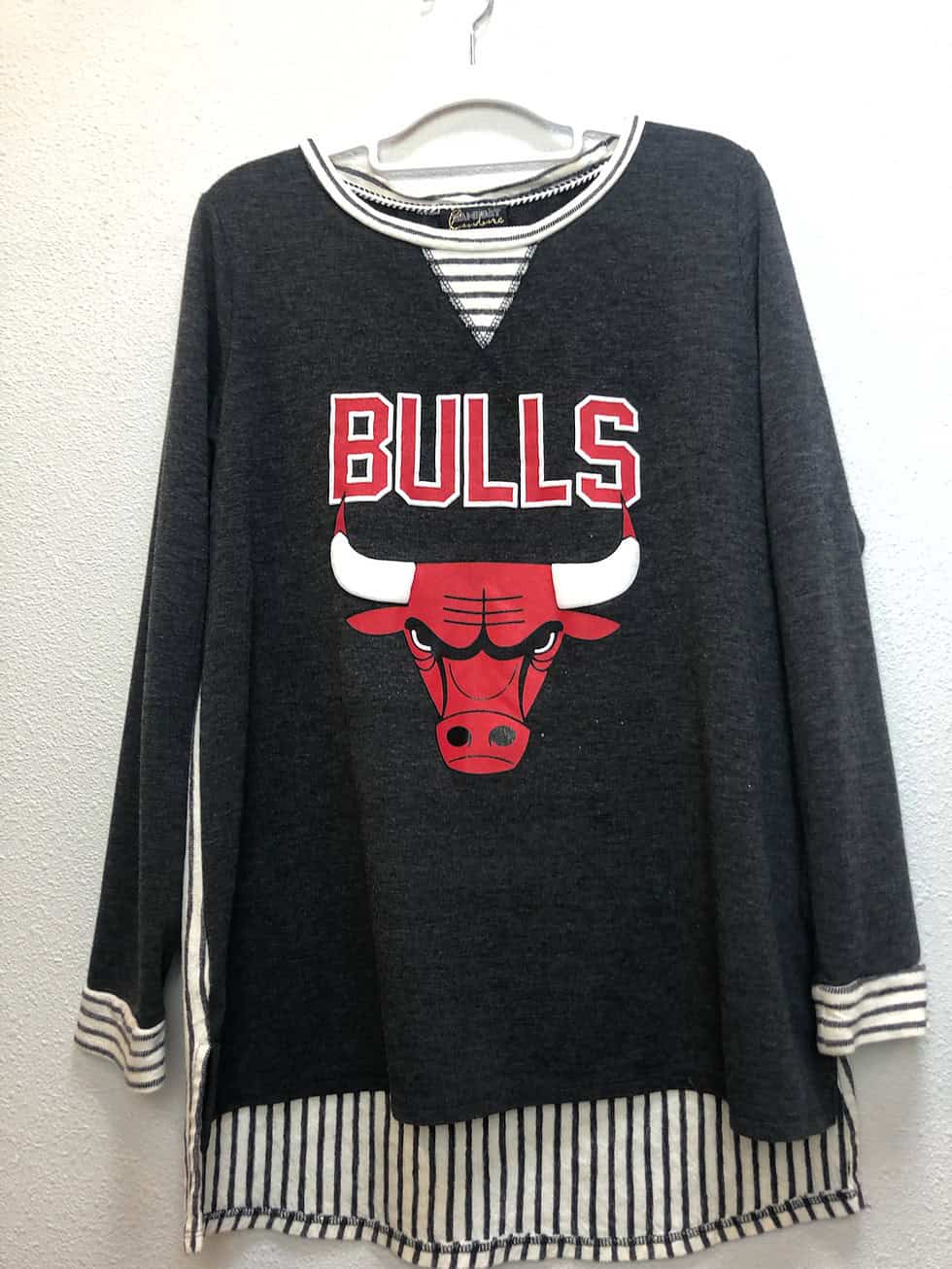Full front view of Chicago Bulls Gameday Couture tunic showing bold logo and stylish hem