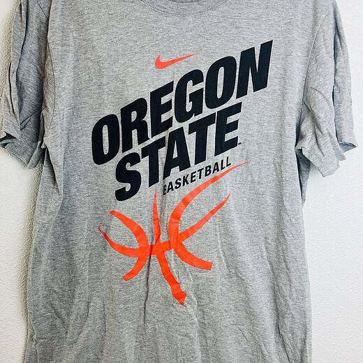 Front of Oregon State Basketball Nike team-issued gray tee with orange basketball graphic.