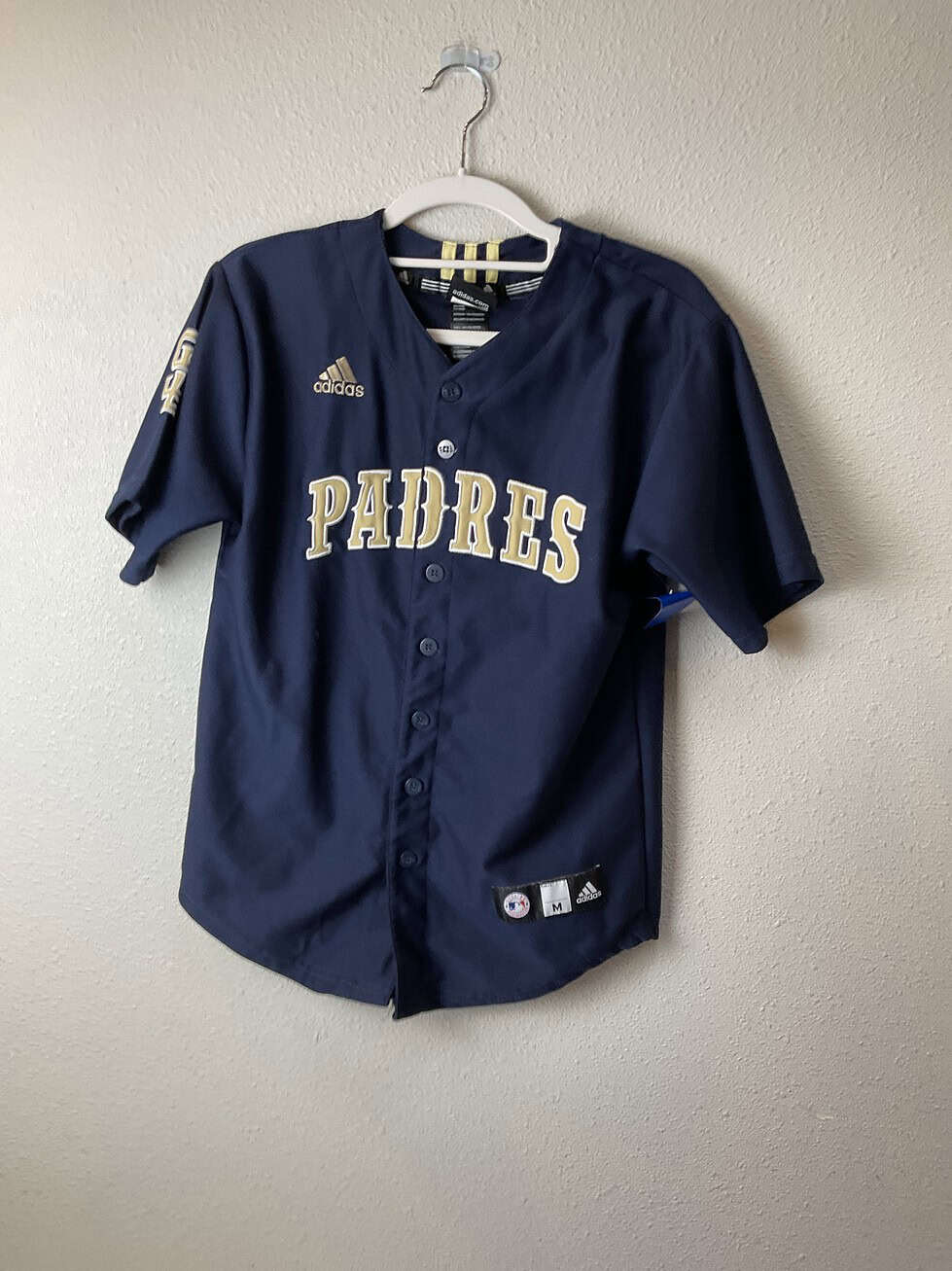 Navy blue San Diego Padres Adidas button-up jersey with gold and white lettering, embroidered Adidas and MLB logos, size medium