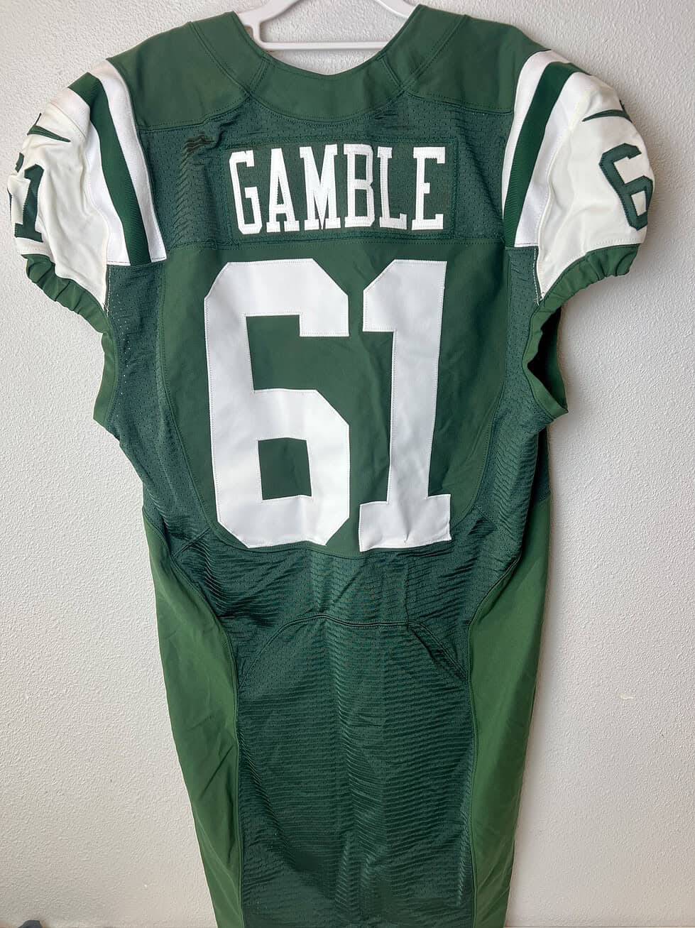 Back view of game-issued Jets jersey showing "Gamble" nameplate and #61.