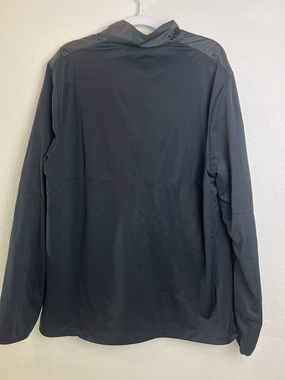 Back view of Oregon Ducks Nike Golf jacket with sleek, modern design.