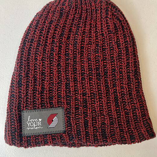 Black and red ribbed Trail Blazers Love Your Melon beanie, front view with no cuff.