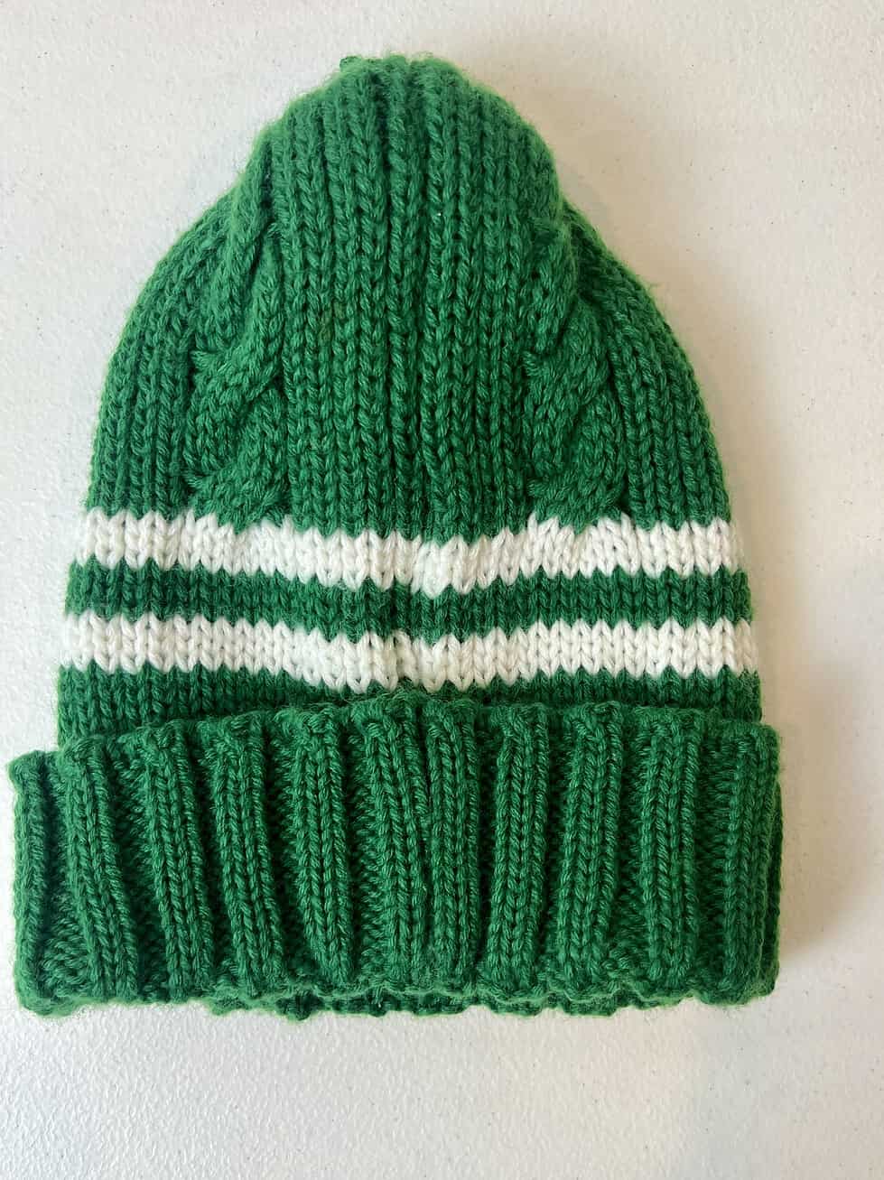 Back view of Jets kids beanie showing knit detail and loose thread at top.