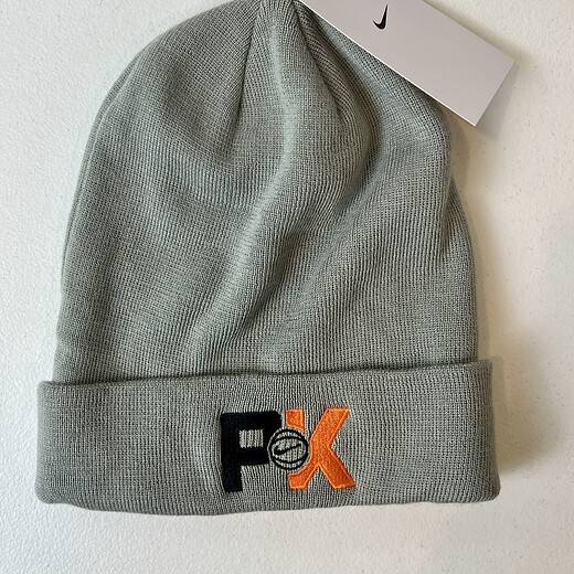 Light gray Nike beanie with embroidered Swoosh and NBA-style tag.