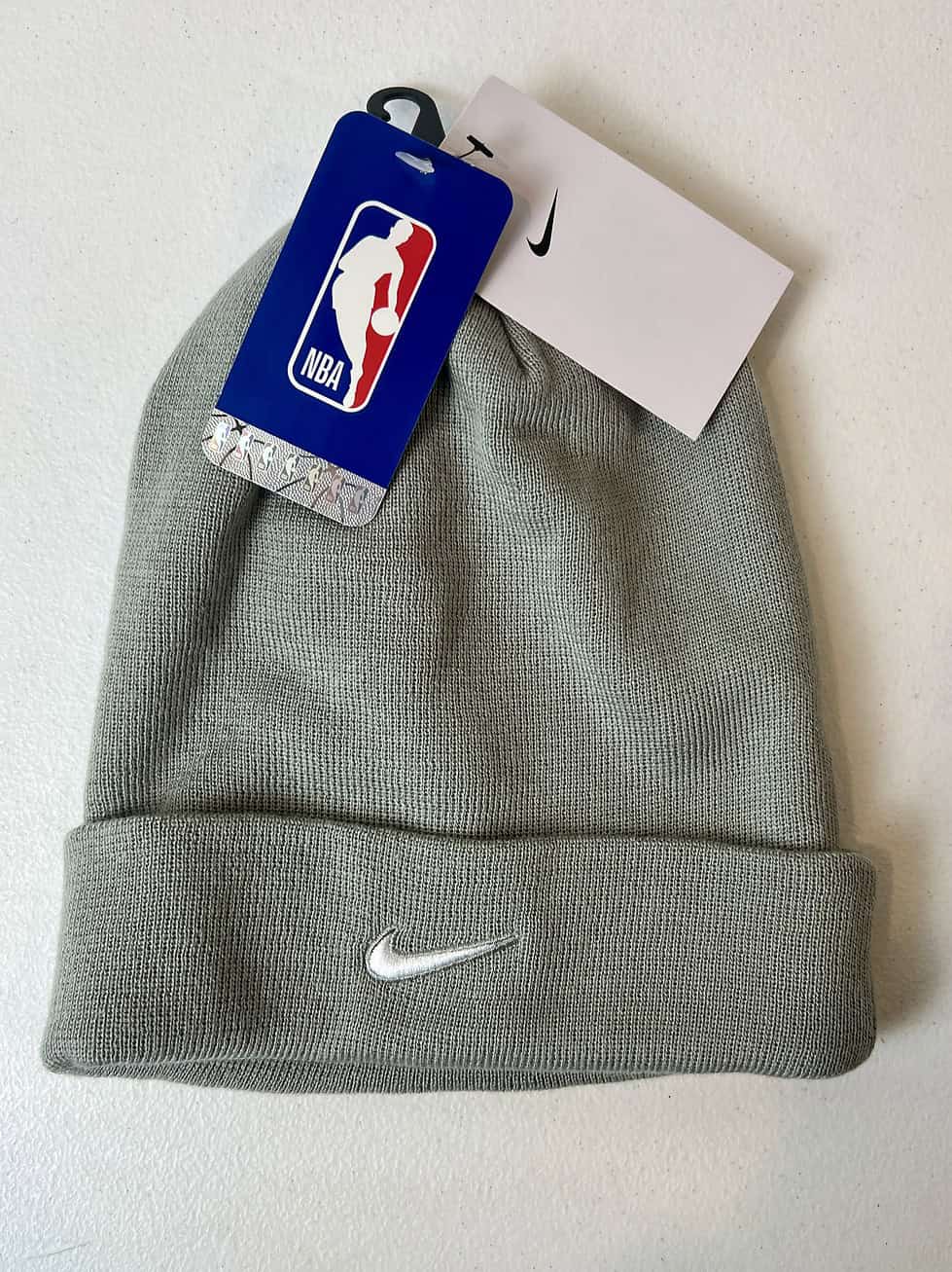 Back view of Nike Phil Knight Invitational beanie with PK logo in black and orange.