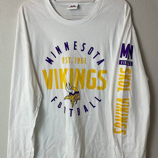 Front view of Minnesota Vikings long-sleeve Majestic shirt with bold graphics.