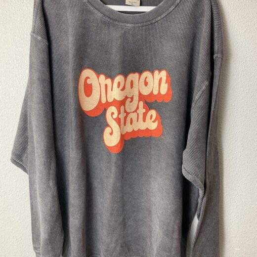 Front view of oversized Oregon State Beavers sweatshirt with retro graphic.
