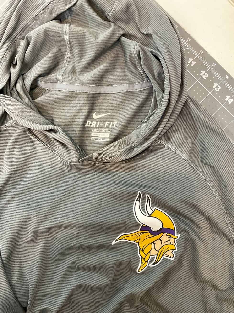 Close-up of Vikings logo and Nike Dri-FIT tag.