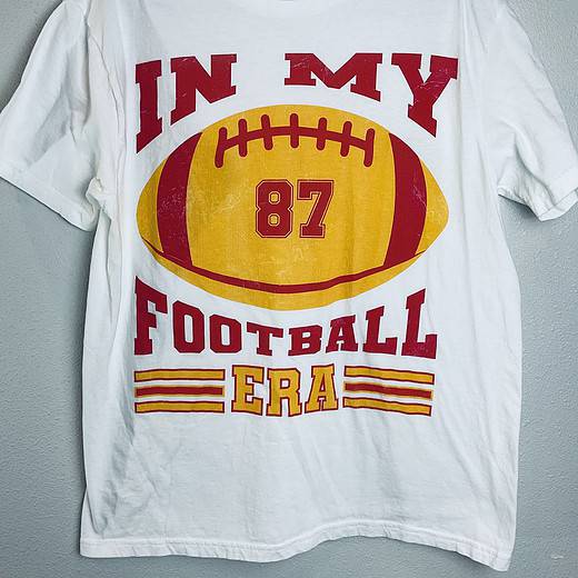 Full view of “In My Football Era” Kansas City Chiefs fan T-shirt with football and #87 graphic.