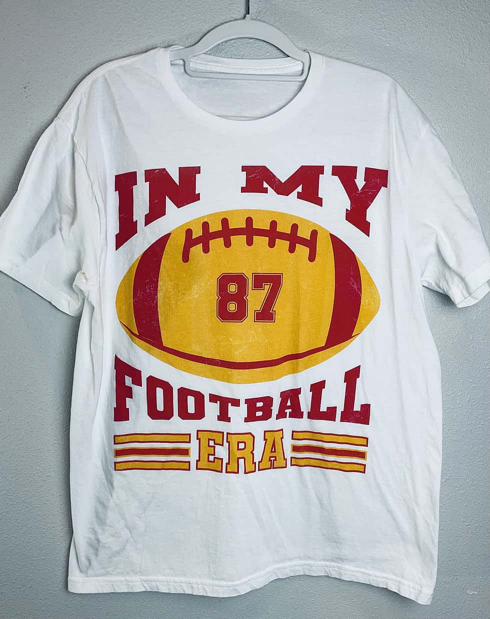Full view of “In My Football Era” Kansas City Chiefs fan T-shirt with football and #87 graphic.