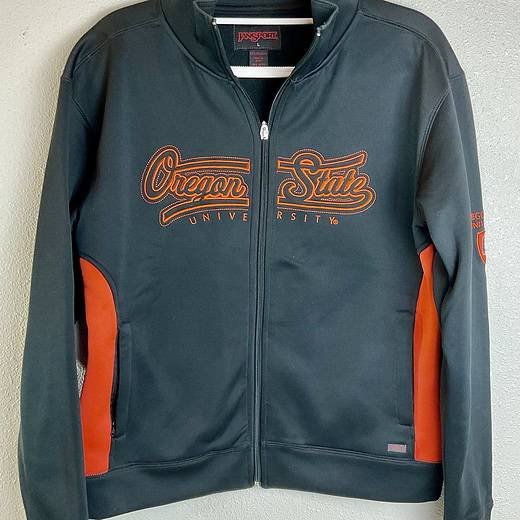 Front view of black Oregon State Beavers full-zip jacket with orange embroidery.