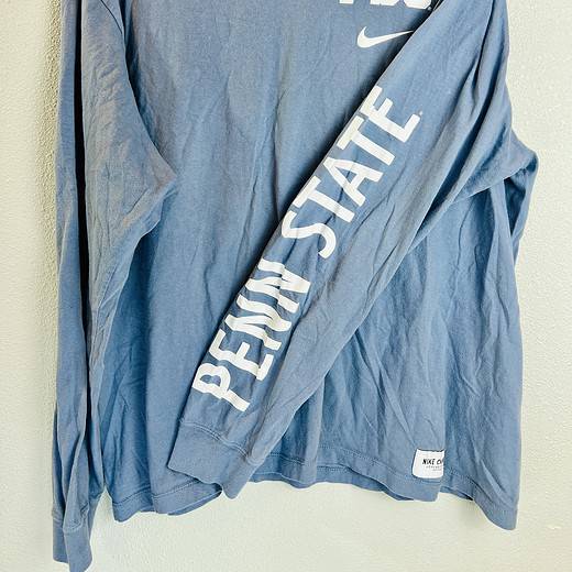 Front view of Penn State Nike tee with “PENN STATE” printed on sleeve