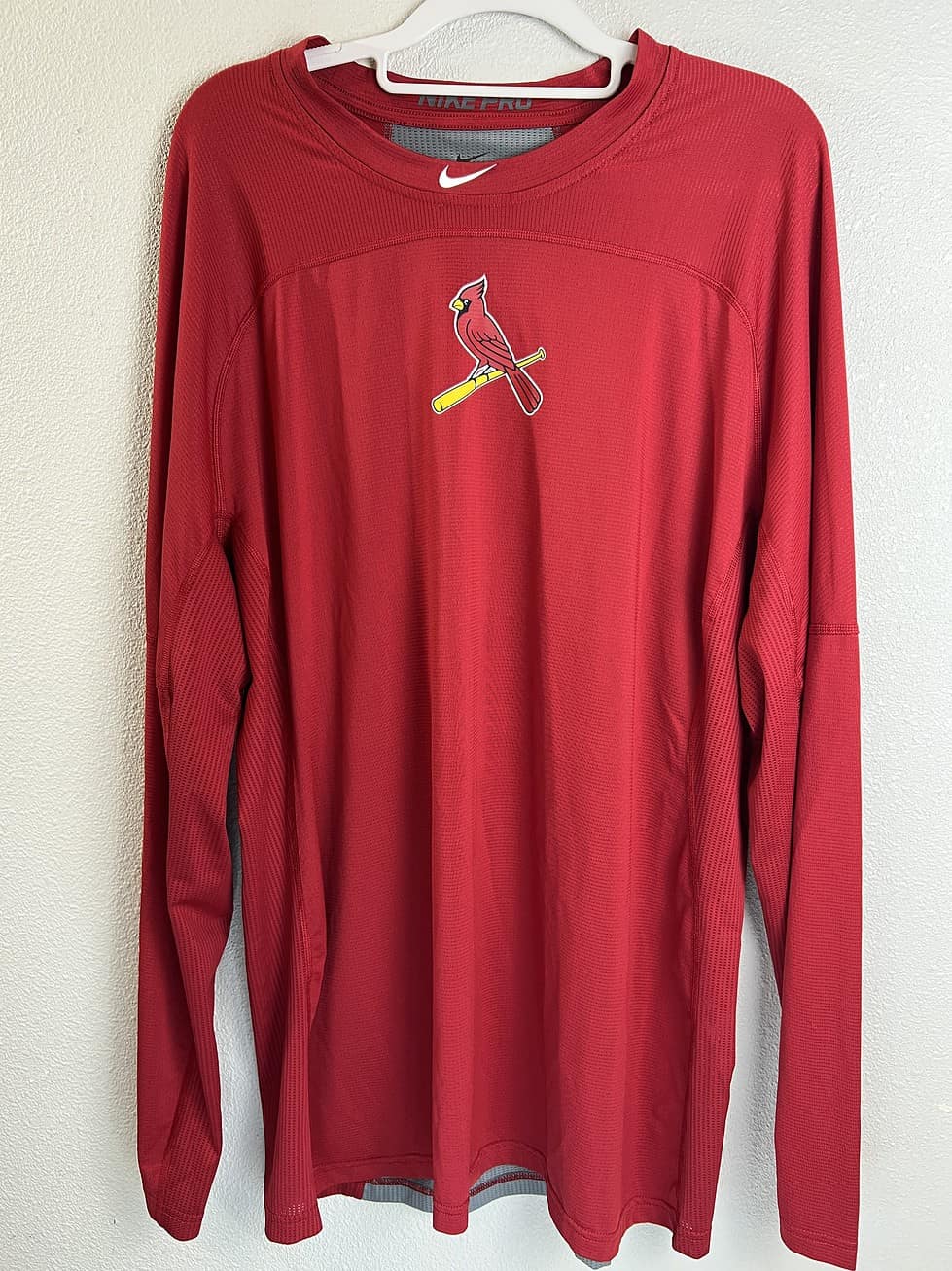 Front view of Nike Pro Cardinals long-sleeve performance shirt featuring team logo