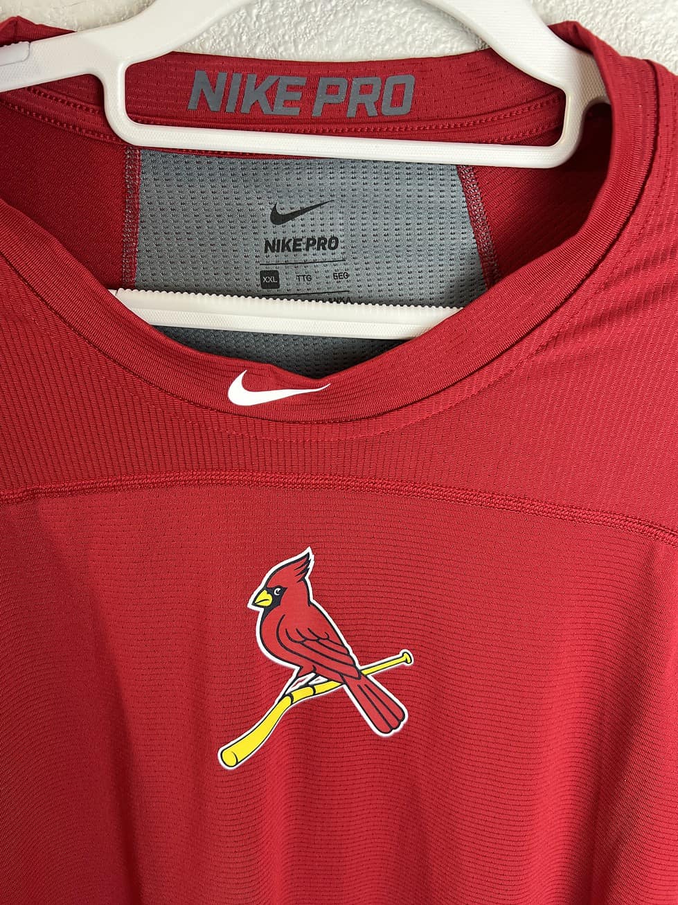 Close-up of Nike Pro St. Louis Cardinals logo on red performance top, size XXL