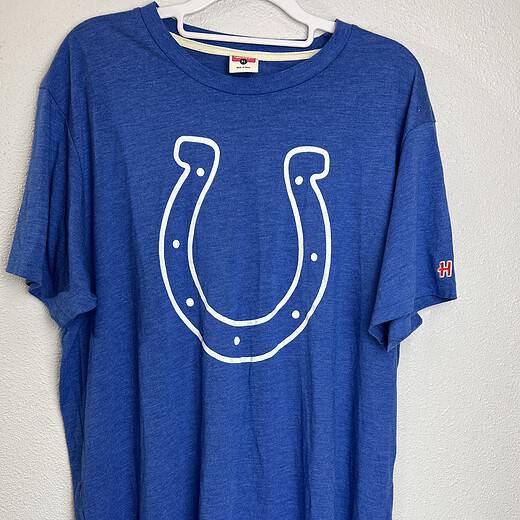 Blue Indianapolis Colts T-shirt with large white horseshoe logo on front.