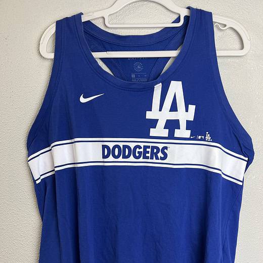 Blue LA Dodgers Nike Dri-FIT racerback tank top with white LA logo and Dodgers text.