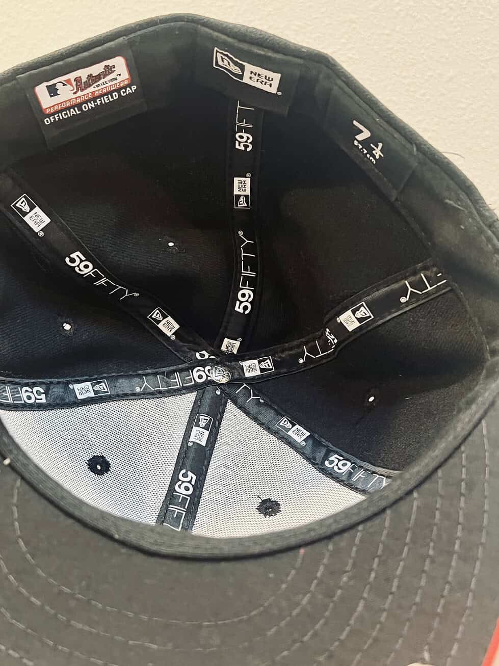 Interior view of New Era 59FIFTY fitted cap, size 7 1/4, showing official MLB Authentic Collection and Performance Headwear labels.
