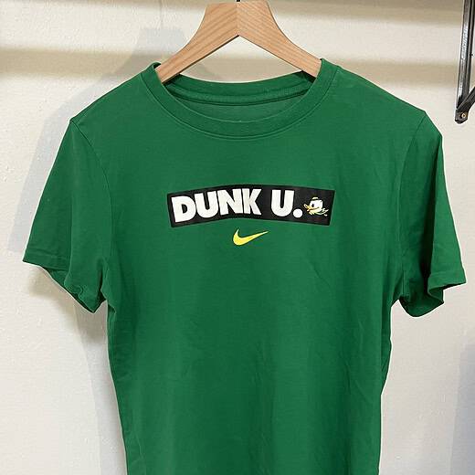 Green Oregon Ducks Nike Dri-FIT tee with "Dunk U" graphic and Puddles logo