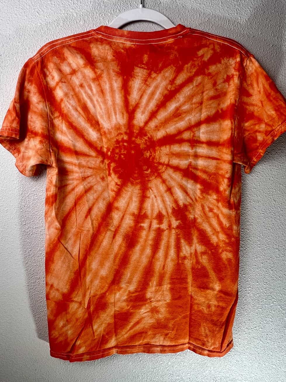 Back view of BreakingT WNBPA tee showing full spiral tie-dye pattern