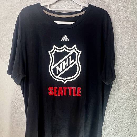 Black Adidas Climalite NHL t-shirt with white NHL shield and red “Seattle” text, size XL