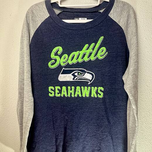 Seattle Seahawks women’s crewneck sweatshirt in navy blue with neon green logo and heather gray sleeves