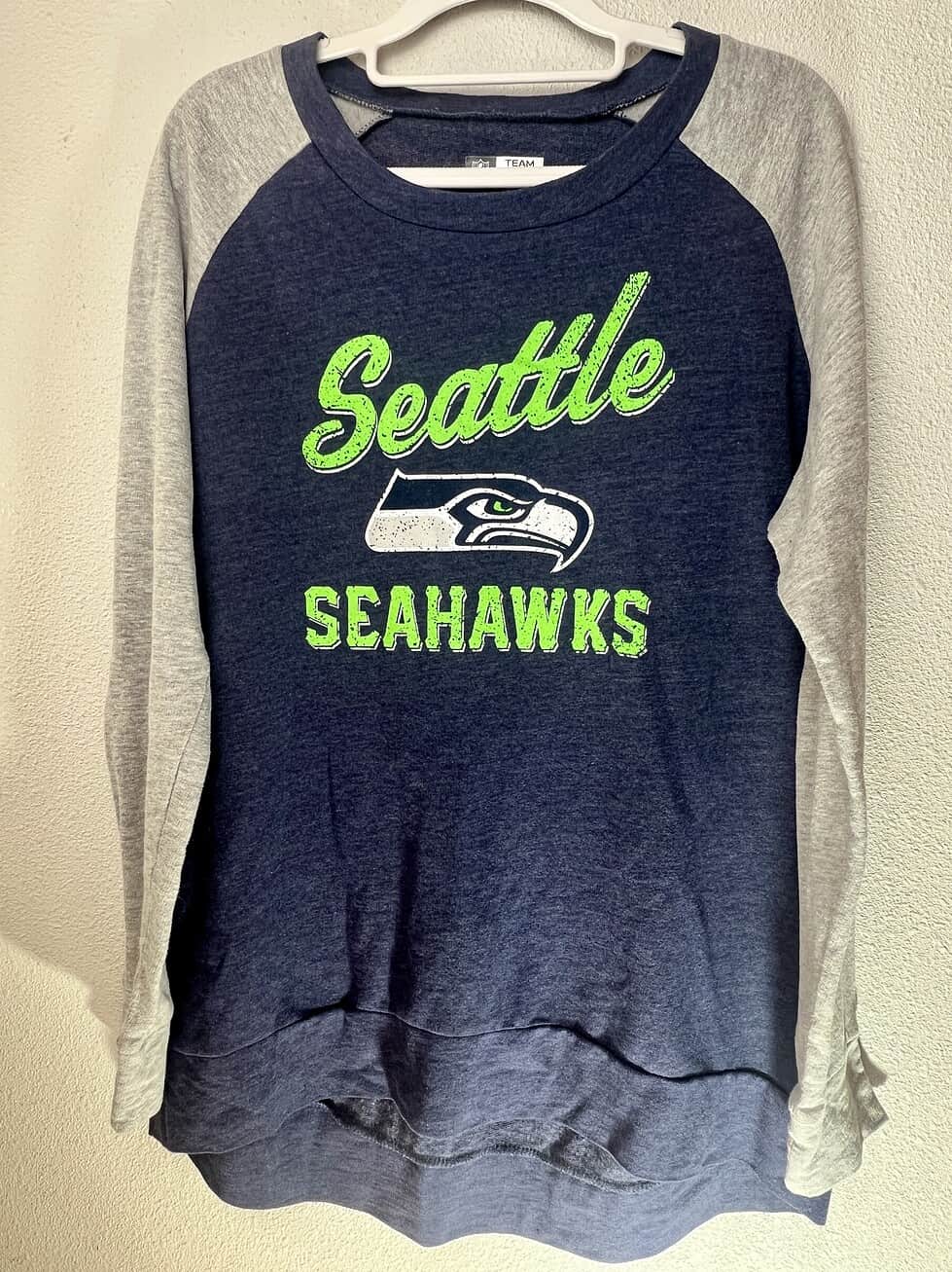 Seattle Seahawks women’s crewneck sweatshirt in navy blue with neon green logo and heather gray sleeves