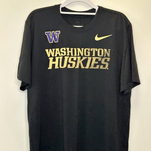 Front of black Nike Dri-FIT UW Huskies T-shirt with gold lettering