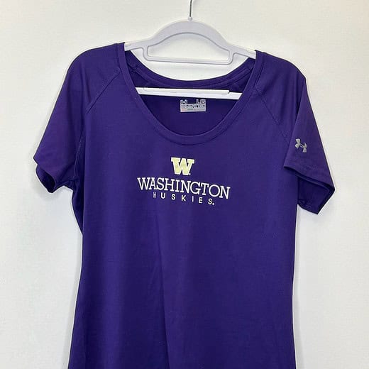 Front of UW Under Armour women's tee with “Washington Huskies” graphic